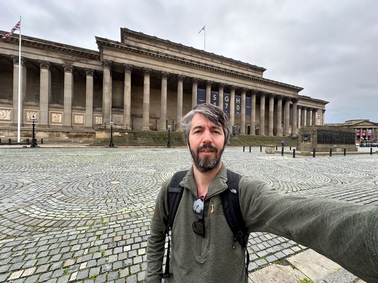 Photo of me stood outside a grand old classical building with columns